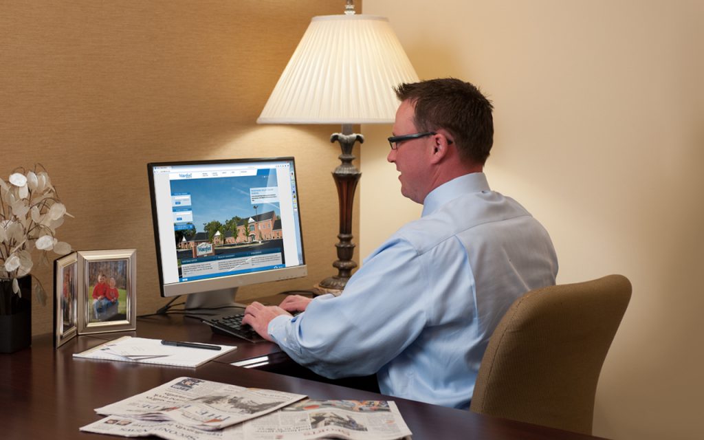 Commercial Lender reviewing website.