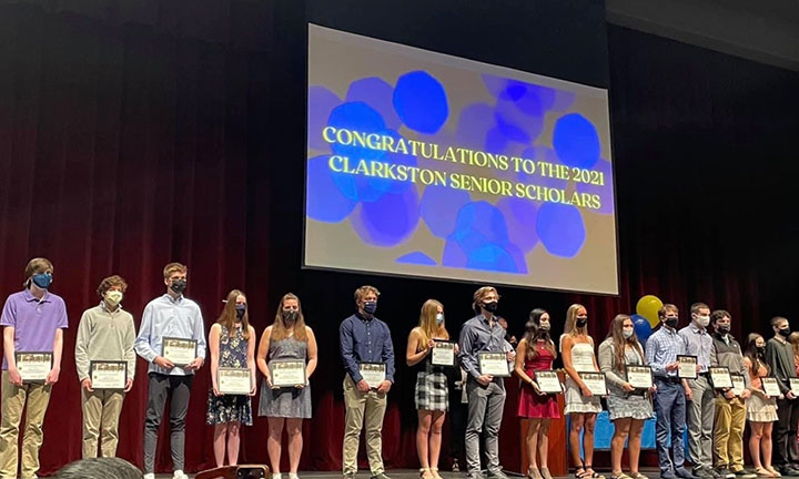 Community outreach - Clarkston High school seniors stand with their top scholar awards presented by the bank