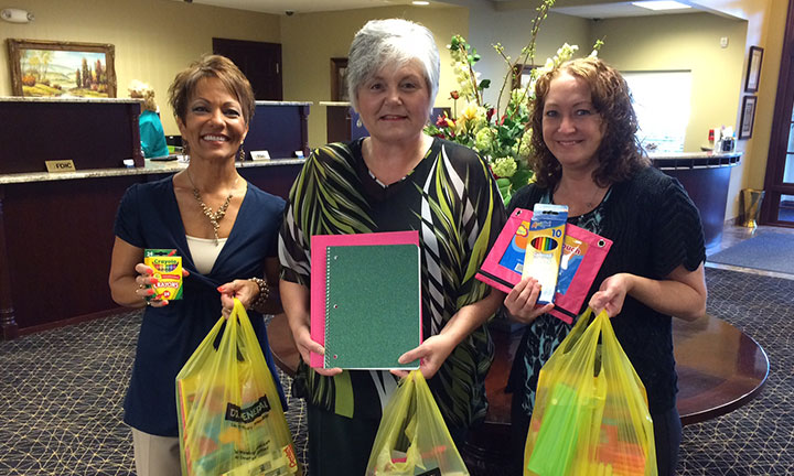 Community outreach - ladies at Waterford bank collect school supplies for students