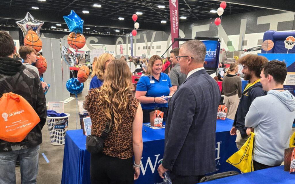 Waterford team members meet with students to talk about banking.