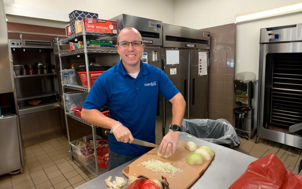 Waterford banker cooks at the Ronald McDonald House for Community Service.