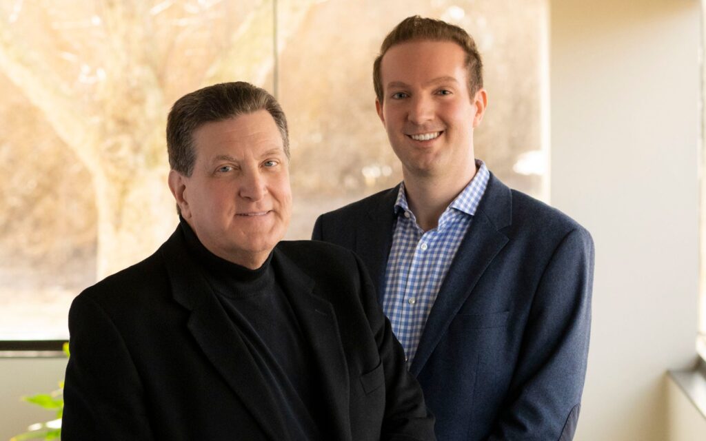 Anthony and A.W. Randazzo of Devonshire of Lyon, a father and son team, smile at camera.