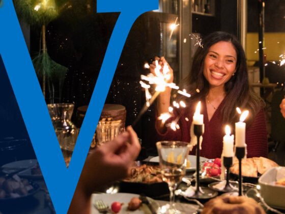 A group of friends celebrates the holidays.