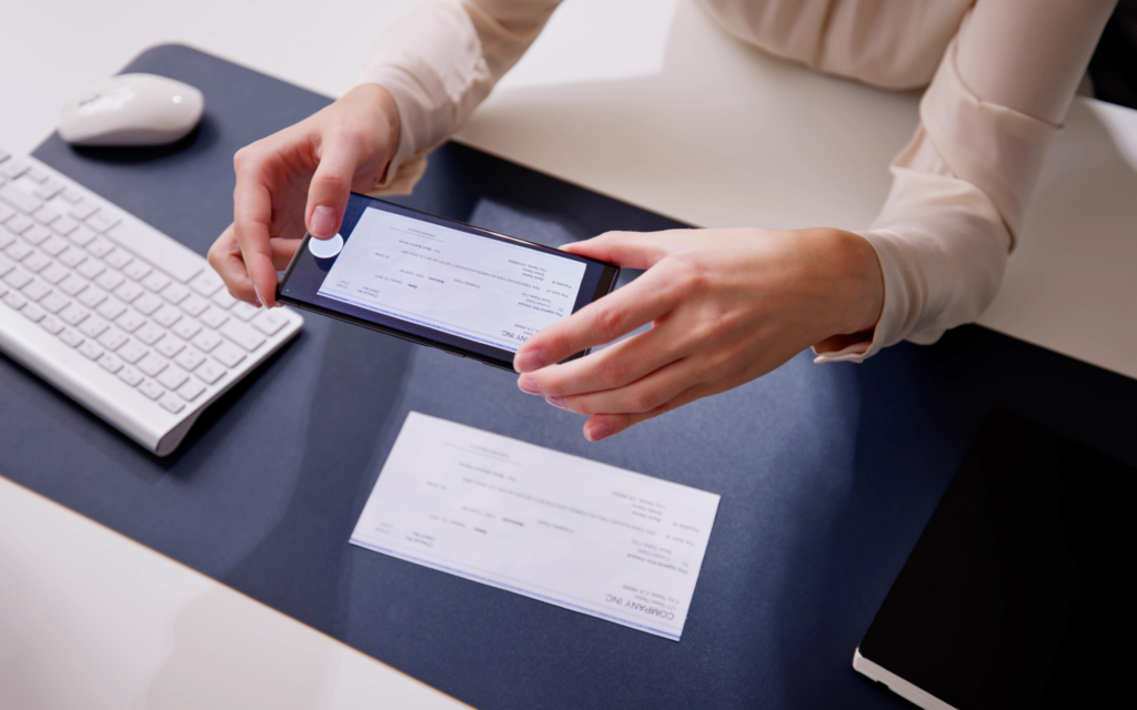 Customer using mobile banking app to manage their finances securely and conveniently on their smartphone.