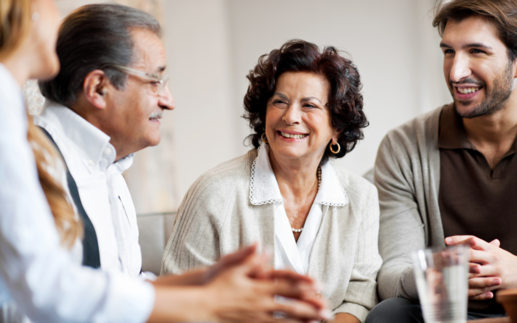 An older couple discusses finances with their adult son.