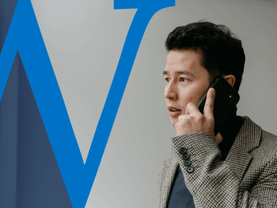 Business man holding a phone to his ear looking concerned.