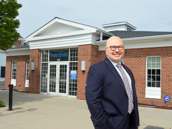 Craig Jablonski smiles in front of the Perrysburg office.